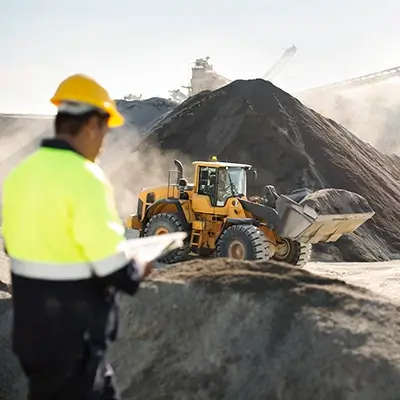 forman overseeing equipment at a quarry